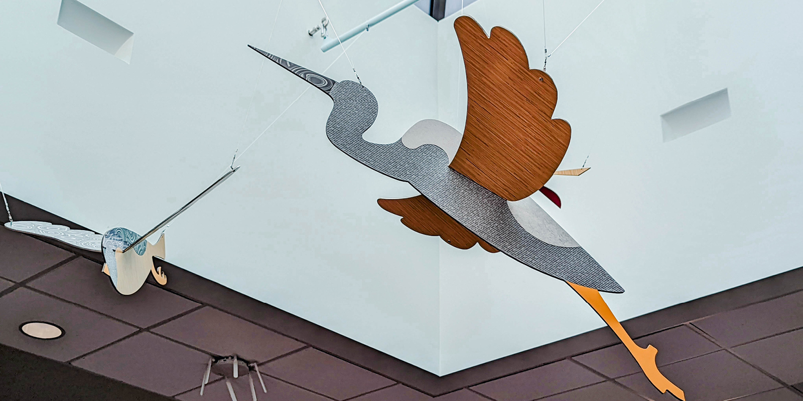 Header image showing a hanging crane inside the library