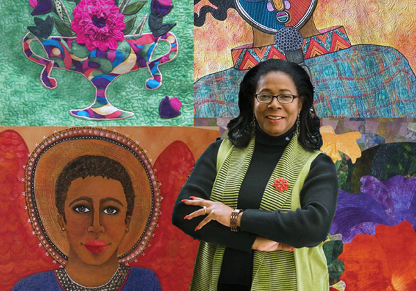 Photo of Dr. Pearlie M. Johnson in front of quilt art