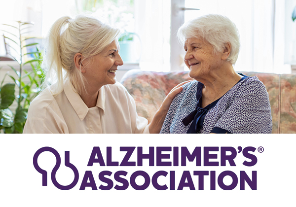 Photo of two women talking & Alzheimer's Association logo