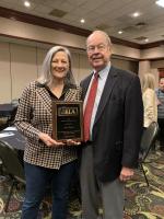 Jean Ruark and James Nelson with Award Plaque 